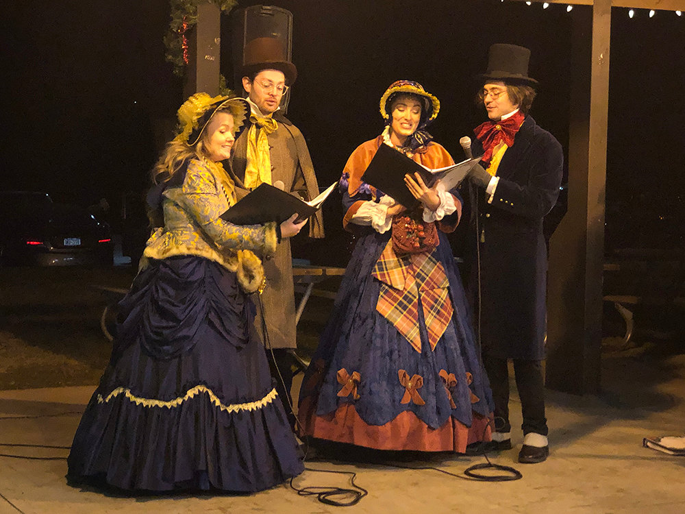 Carolers ring in the Christmas season with classical tunes for Newburgh residents to enjoy.